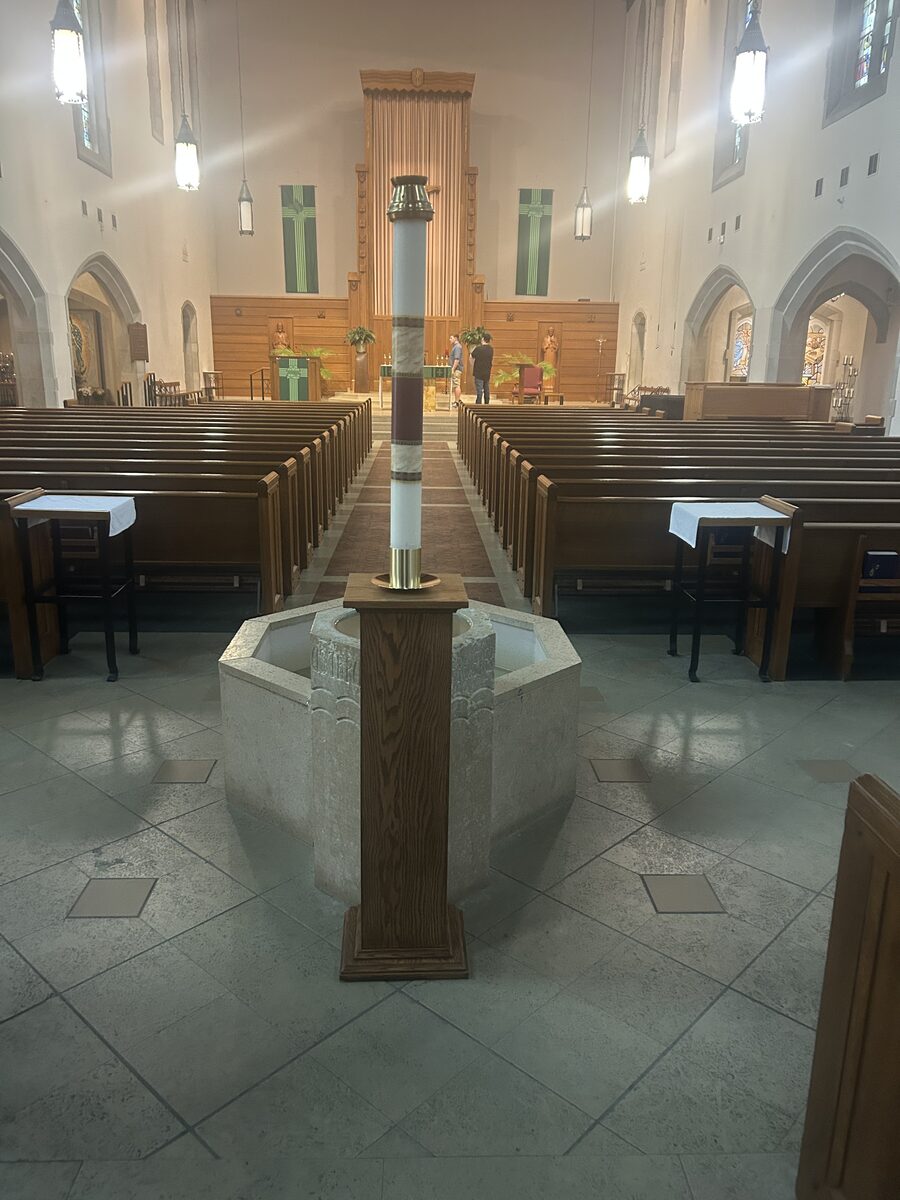 Church interior with custom oak Paschal candle stand at the baptismal area